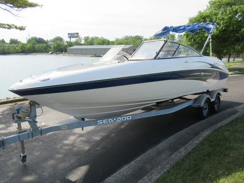 Slide: The Image of 2004 Yamaha Boats SX230 on trailer by lakeside. - 8