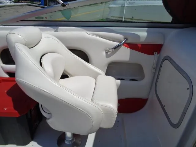 Slide: The Image of White captain's chair in 2006 Crownline 220 CCR boat interior. - 15