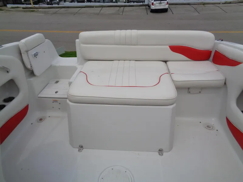 Slide: The Image of 2006 Crownline 220 CCR boat interior with white and red seating. - 16