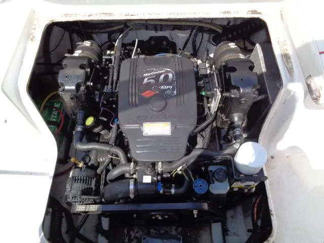 Slide: The Image of Engine compartment of a 2006 Crownline 220 CCR boat, featuring a MerCruiser 5.0 MPI engine. - 26