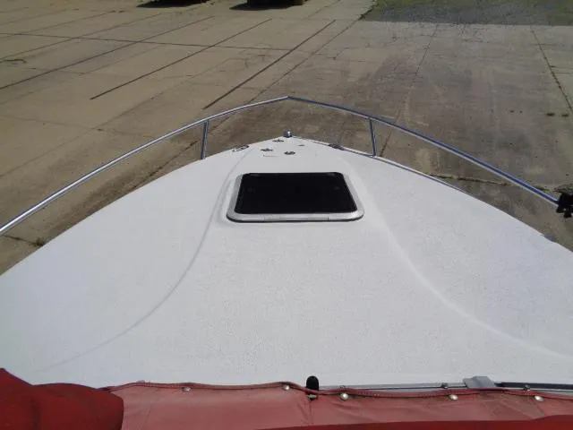 Slide: The Image of 2006 Crownline 220 CCR boat bow view with hatch and railing. - 4