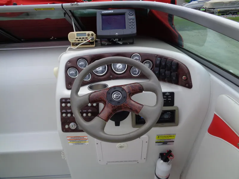 Slide: The Image of 2006 Crownline 220 CCR boat dashboard with steering wheel and navigation equipment. - 5