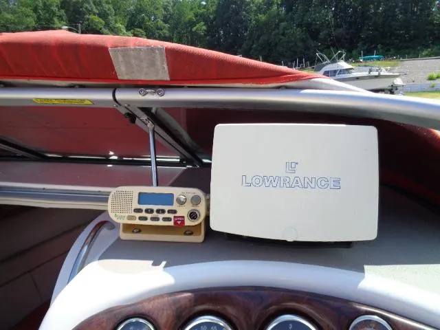 Slide: The Image of 2006 Crownline 220 CCR boat dashboard with Lowrance navigation system and radio. - 7