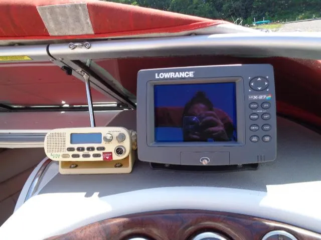 Slide: The Image of 2006 Crownline 220 CCR boat dashboard with Lowrance GPS and radio equipment. - 8