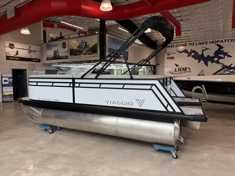 Slide: The Image of 2026 Viaggio V16U pontoon boat displayed indoors at Lake Hopatcong Marine showroom. - 5