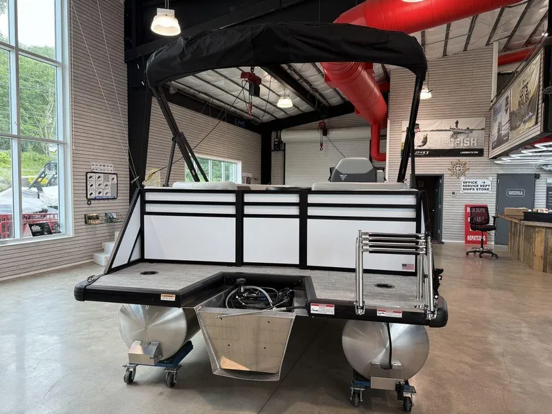 Slide: The Image of 2026 Viaggio V16U pontoon boat in showroom, featuring sleek design and modern amenities. - 6