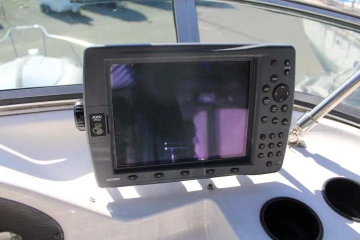 Slide: The Image of Navigation system on 1997 Bayliner 4087 Aft Cabin Motoryacht dashboard. - 17