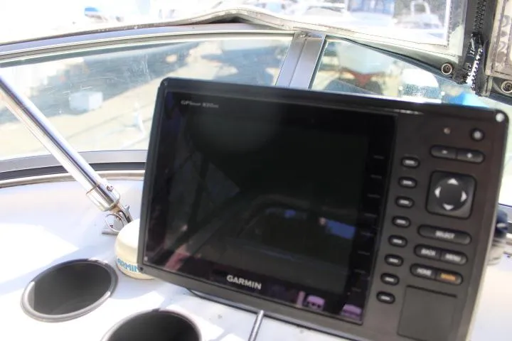 Slide: The Image of Garmin GPS device on 1997 Bayliner 4087 Aft Cabin Motoryacht dashboard. - 18