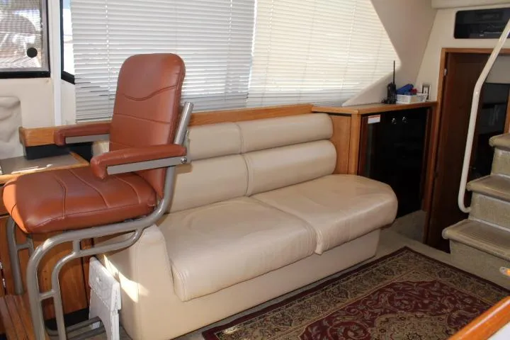 Slide: The Image of 1997 Bayliner 4087 Aft Cabin Motoryacht interior with leather seating and captain's chair. - 28