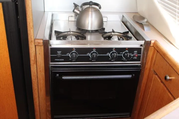 Slide: The Image of Stove and oven in 1997 Bayliner 4087 Aft Cabin Motoryacht kitchen. - 34