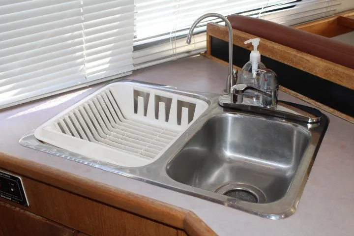 Slide: The Image of Stainless steel sink with drainer in 1997 Bayliner 4087 Aft Cabin Motoryacht kitchen. - 35