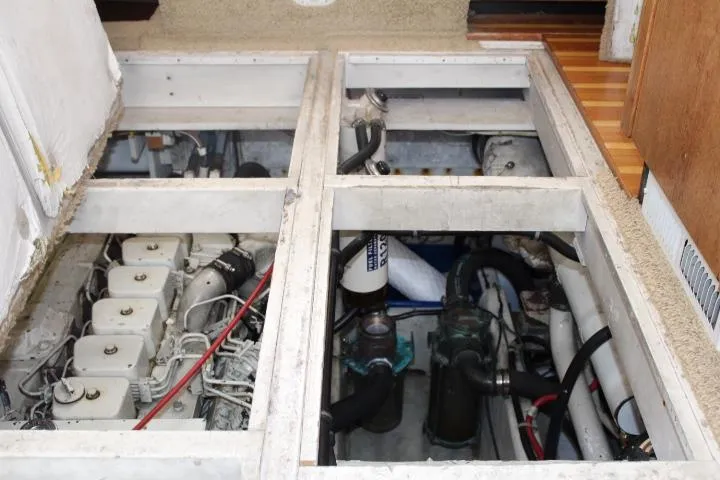 Slide: The Image of Engine compartment of 1997 Bayliner 4087 Aft Cabin Motoryacht, showing mechanical components and systems. - 38