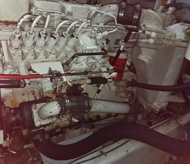 Slide: The Image of Engine compartment of a 1997 Bayliner 4087 Aft Cabin Motoryacht, showing detailed mechanical components. - 40