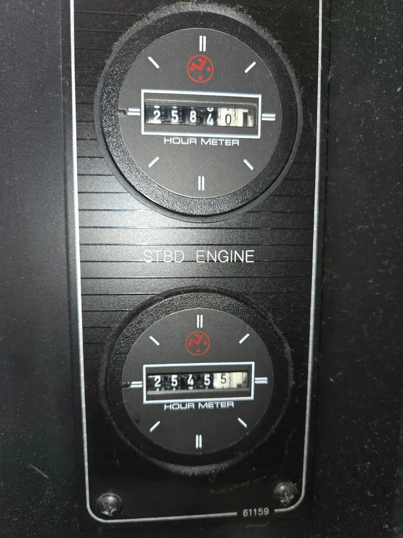 Slide: The Image of Hour meters on 1997 Bayliner 4087 Aft Cabin Motoryacht engine panel. - 43