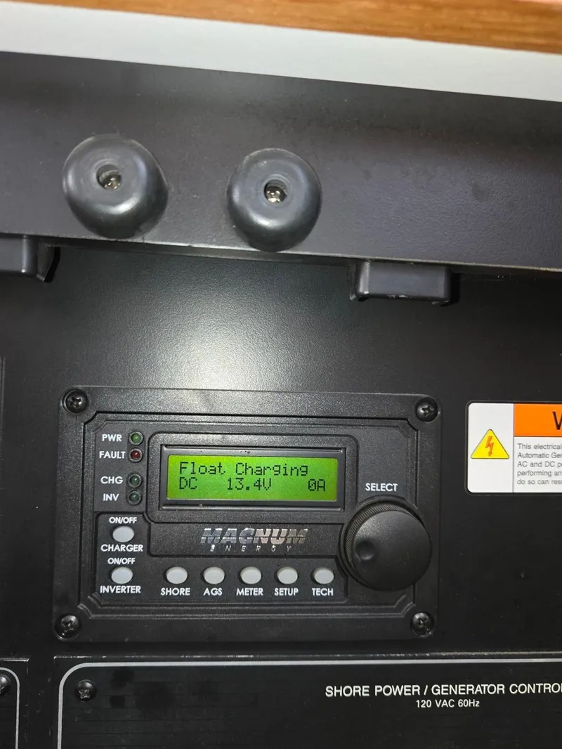 Slide: The Image of Control panel of a 1997 Bayliner 4087 Aft Cabin Motoryacht showing float charging status. - 46