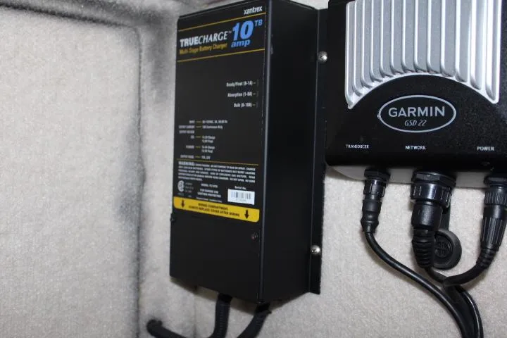 Slide: The Image of Battery charger and Garmin device in 1997 Bayliner 4087 Aft Cabin Motoryacht. - 48