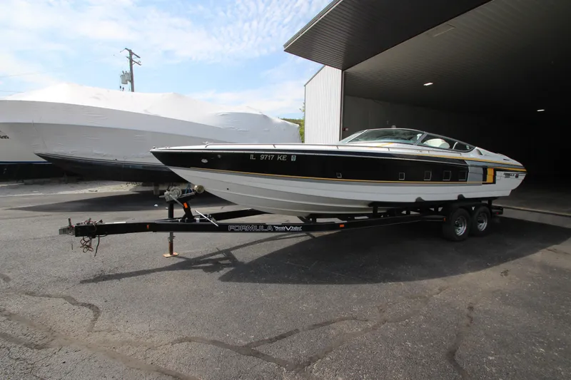 Slide: The Image of 2008 Formula 292 FASTech boat on trailer, parked outside a storage facility. - 1