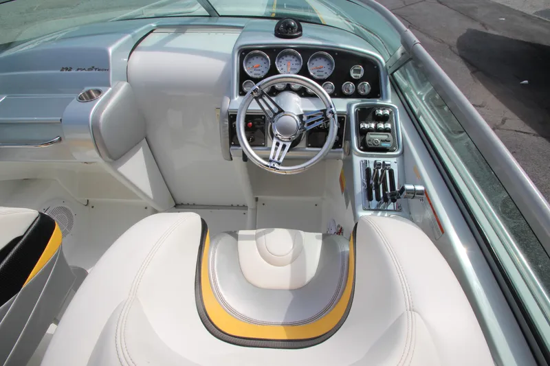 Slide: The Image of 2008 Formula 292 FASTech boat cockpit with steering wheel and control panel. - 10