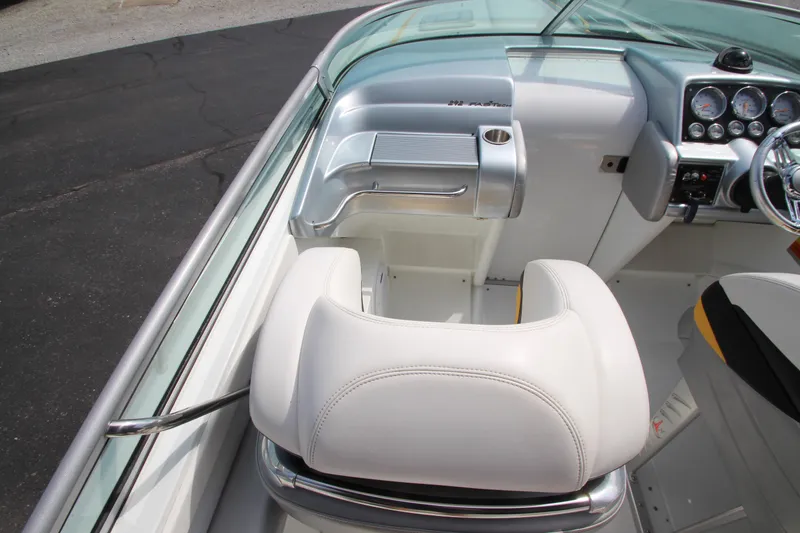 Slide: The Image of 2008 Formula 292 FASTech boat interior with white seating and sleek dashboard design. - 11