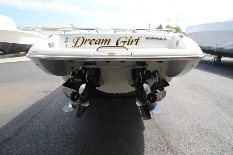 Slide: The Image of 2008 Formula 292 FASTech boat, rear view with dual propellers, labeled "Dream Girl." - 4
