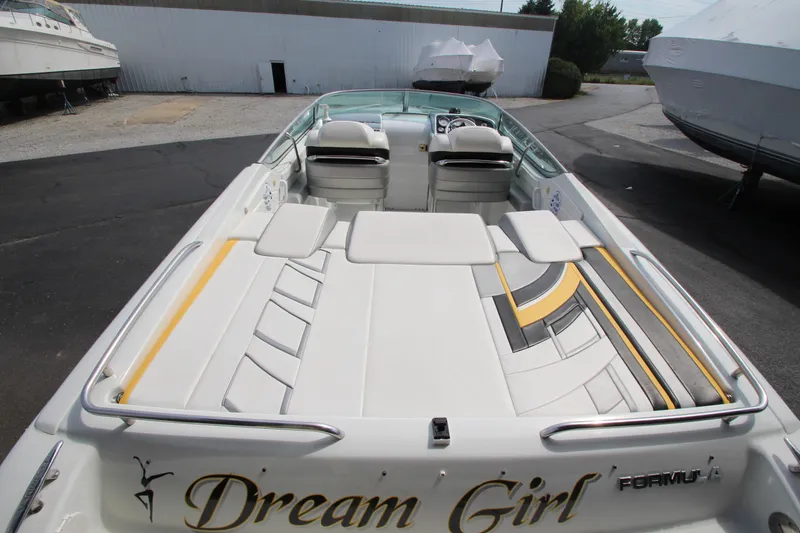 Slide: The Image of 2008 Formula 292 FASTech boat with "Dream Girl" text, featuring sleek seating and stylish design. - 7