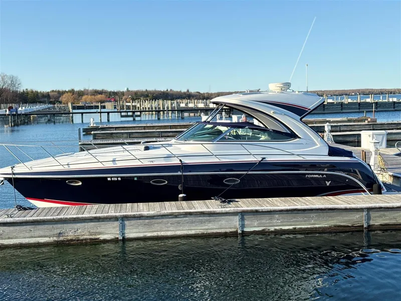 Slide: The Image of 2013 Formula 37 PC yacht docked at marina under clear blue sky. - 13