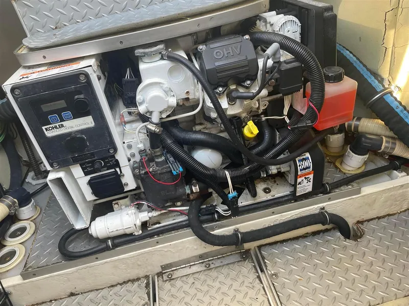 Slide: The Image of Engine compartment of a 2013 Formula 37 PC boat with Kohler generator. - 18
