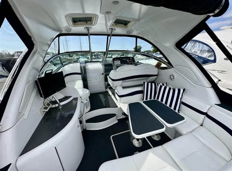 Slide: The Image of Interior of 2013 Formula 37 PC yacht with modern seating and striped cushions. - 2