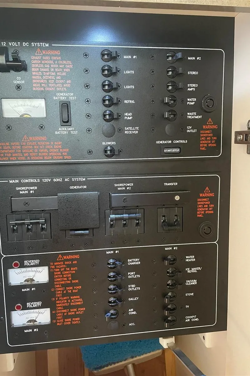 Slide: The Image of Control panel of a 2013 Formula 37 PC boat, featuring electrical system switches and warnings. - 20