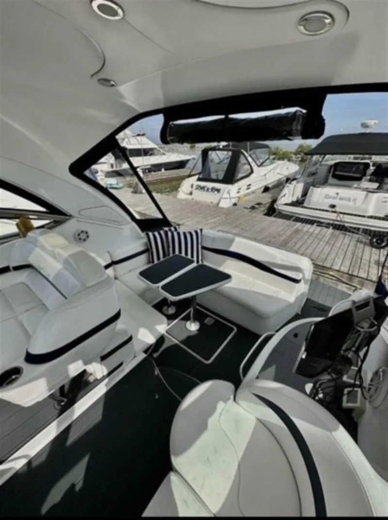 Slide: The Image of Interior of a 2013 Formula 37 PC yacht with white seating and striped cushions. - 3