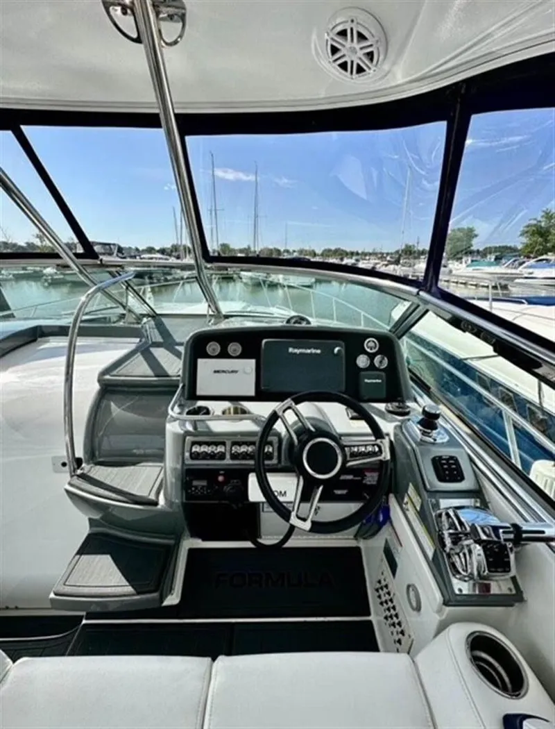 Slide: The Image of Cockpit of 2013 Formula 37 PC yacht with modern navigation equipment and steering wheel. - 4