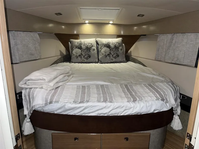 Slide: The Image of Cozy bedroom in 2013 Formula 37 PC yacht with elegant bedding and soft lighting. - 6