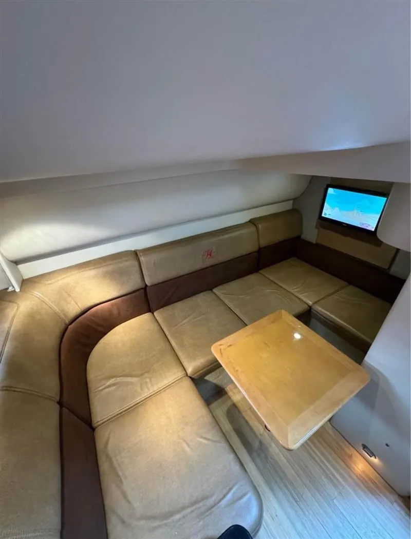 Slide: The Image of Interior of 2013 Formula 37 PC yacht with beige leather seating and wooden table. - 8