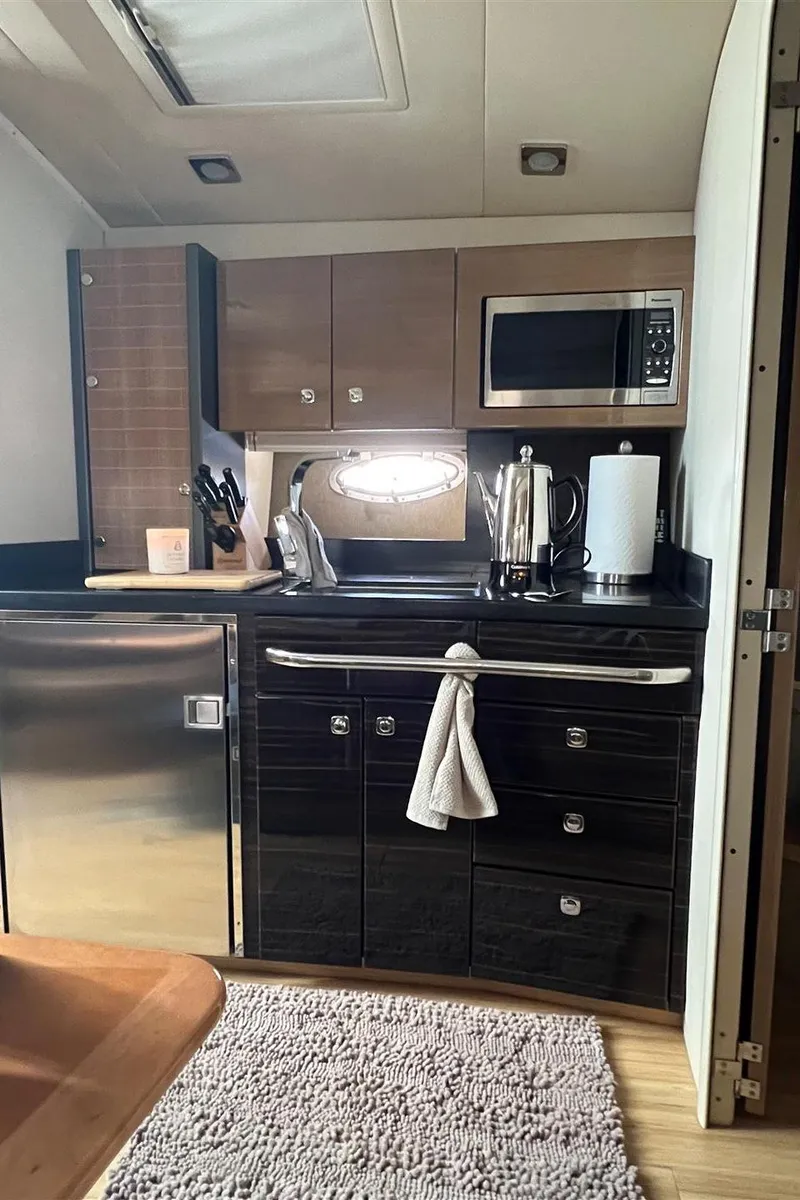 Slide: The Image of Modern kitchen in a 2013 Formula 37 PC yacht with stainless steel appliances. - 9