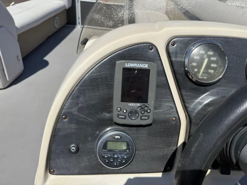 Slide: The Image of Dashboard of 2017 Sweetwater 2286 C boat with Lowrance display and gauges. - 13