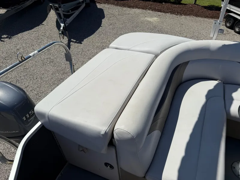 Slide: The Image of 2017 Sweetwater 2286 C boat with white cushioned seating and Yamaha 115 engine. - 17