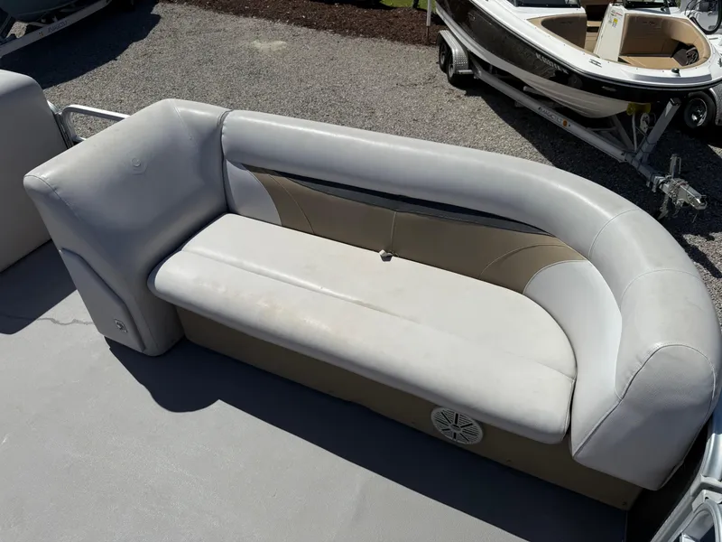 Slide: The Image of 2017 Sweetwater 2286 C boat seat with beige and gray upholstery. - 18