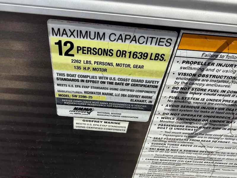 Slide: The Image of Maximum capacity label on 2017 Sweetwater 2286 C boat, 12 persons or 1639 lbs. - 22