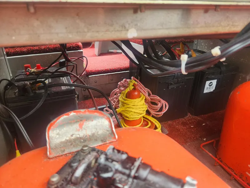 Slide: The Image of Interior of a 1987 Sea Nymph Traveler boat showing batteries and equipment. - 12