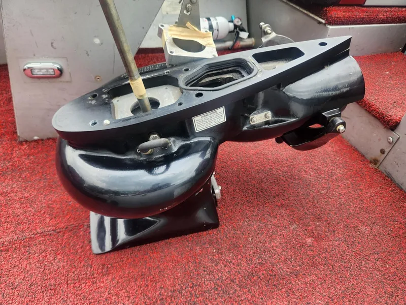 Slide: The Image of 1987 Sea Nymph Traveler boat part on red carpeted surface. - 8