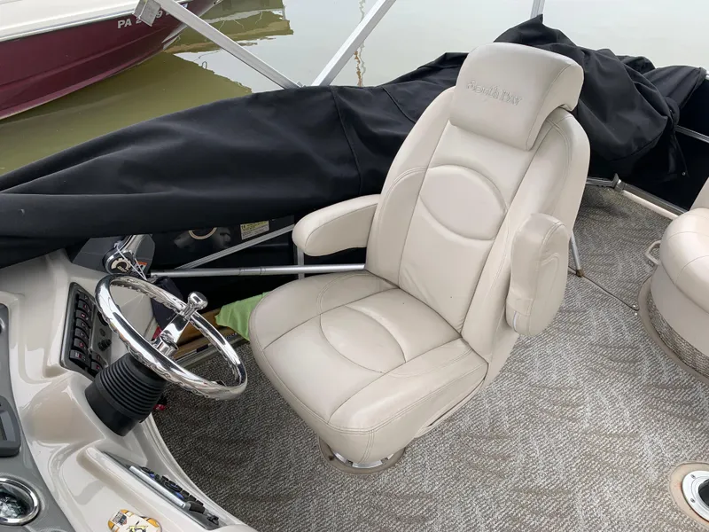Slide: The Image of Captain's chair and steering wheel of 2009 South Bay 825 CR boat. - 3
