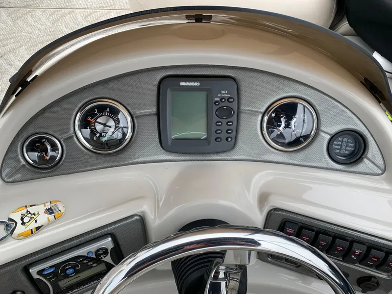 Slide: The Image of Dashboard of 2009 South Bay 825 CR boat with gauges and GPS display. - 5