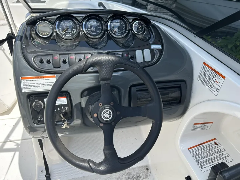 Slide: The Image of 2006 Yamaha Boats SX 210 dashboard with steering wheel and instrument panel. - 3
