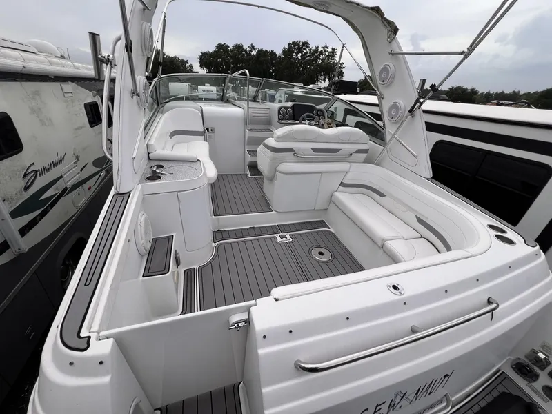 Slide: The Image of 2006 Formula 27 PC boat interior with white seating and modern dashboard. - 11