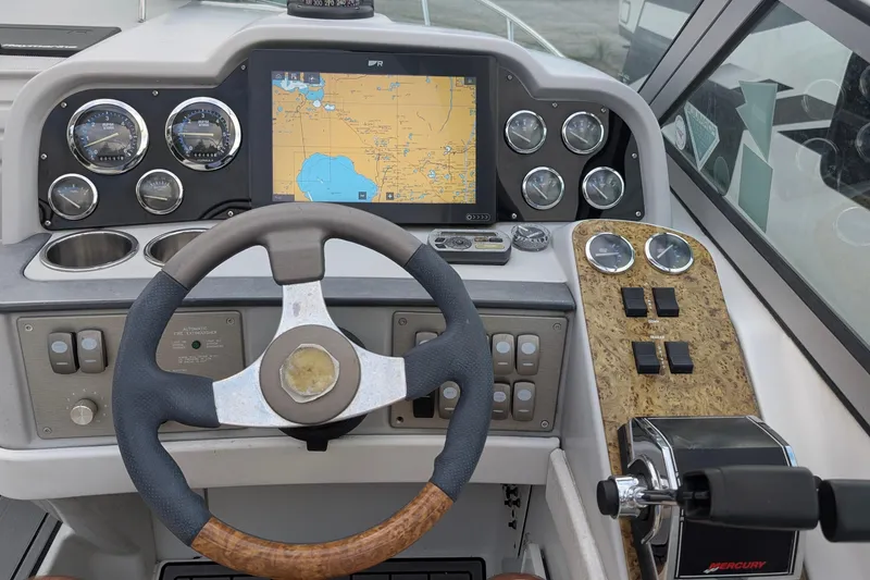 Slide: The Image of 2006 Formula 27 Performance Cruiser dashboard with navigation system and controls. - 15