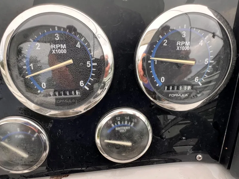 Slide: The Image of Close-up of 2006 Formula 27 PC boat gauges showing RPM and battery voltage. - 16
