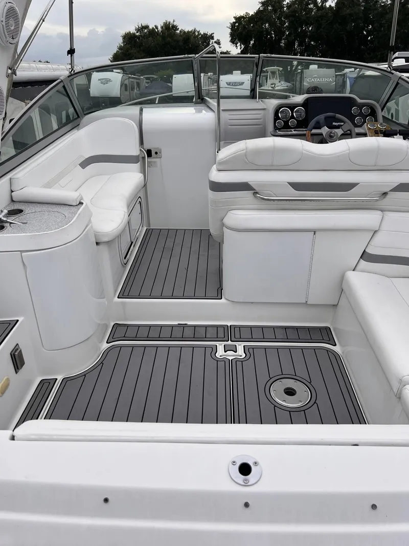 Slide: The Image of 2006 Formula 27 PC boat interior with white seating and gray flooring. - 17