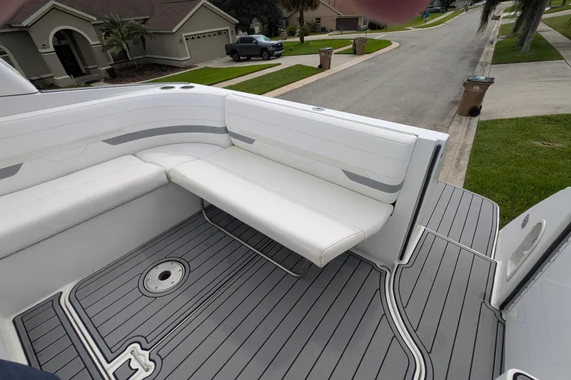 Slide: The Image of 2006 Formula 27 Performance Cruiser boat interior with white seating and gray deck. - 21