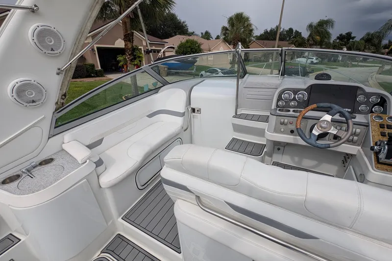 Slide: The Image of 2006 Formula 27 Performance Cruiser cockpit with white seating and modern dashboard. - 22