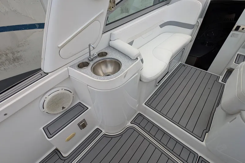 Slide: The Image of 2006 Formula 27 Performance Cruiser interior with sink, seating, and speaker. - 23
